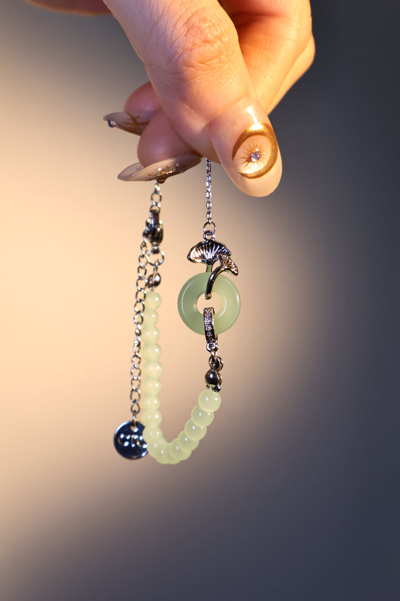 Palladium white gold plated bracelet with a jade ginkgo leaf and sparkling zirconia diamonds