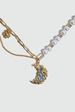 18K gold plated moon necklace with a blue resin moon and synthetic pearls