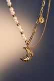 18K gold plated moon necklace with a blue resin moon and synthetic pearls