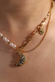 18K gold plated moon necklace with a blue resin moon and synthetic pearls