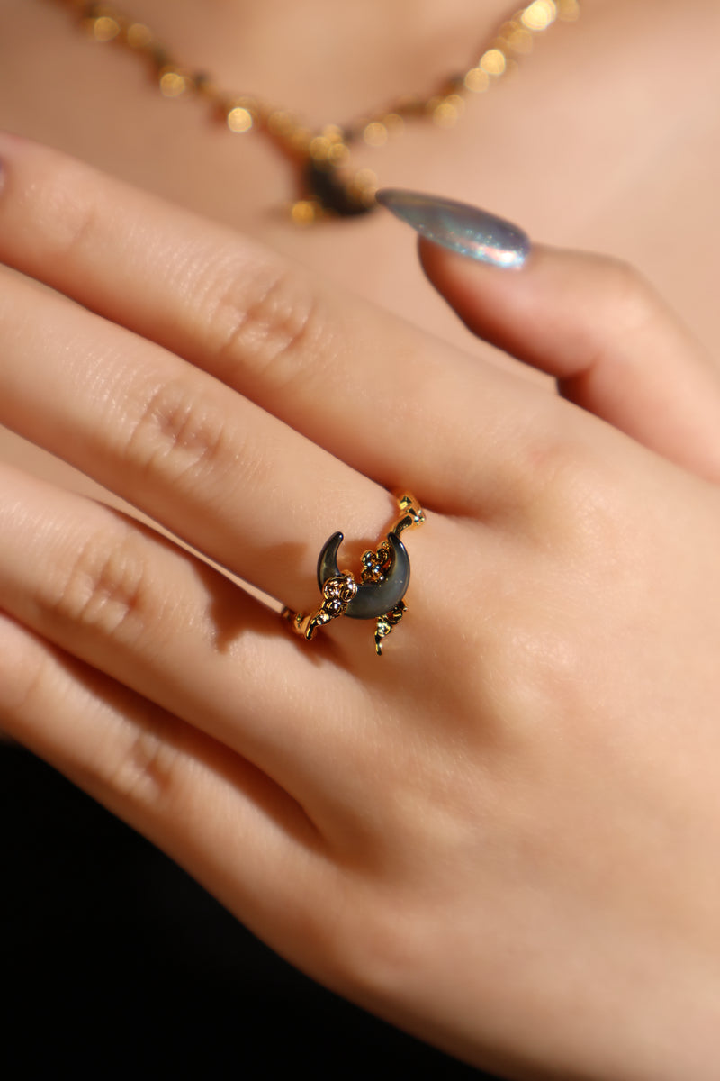 18K gold plated ring with a black natural shell moon on an adjustable band