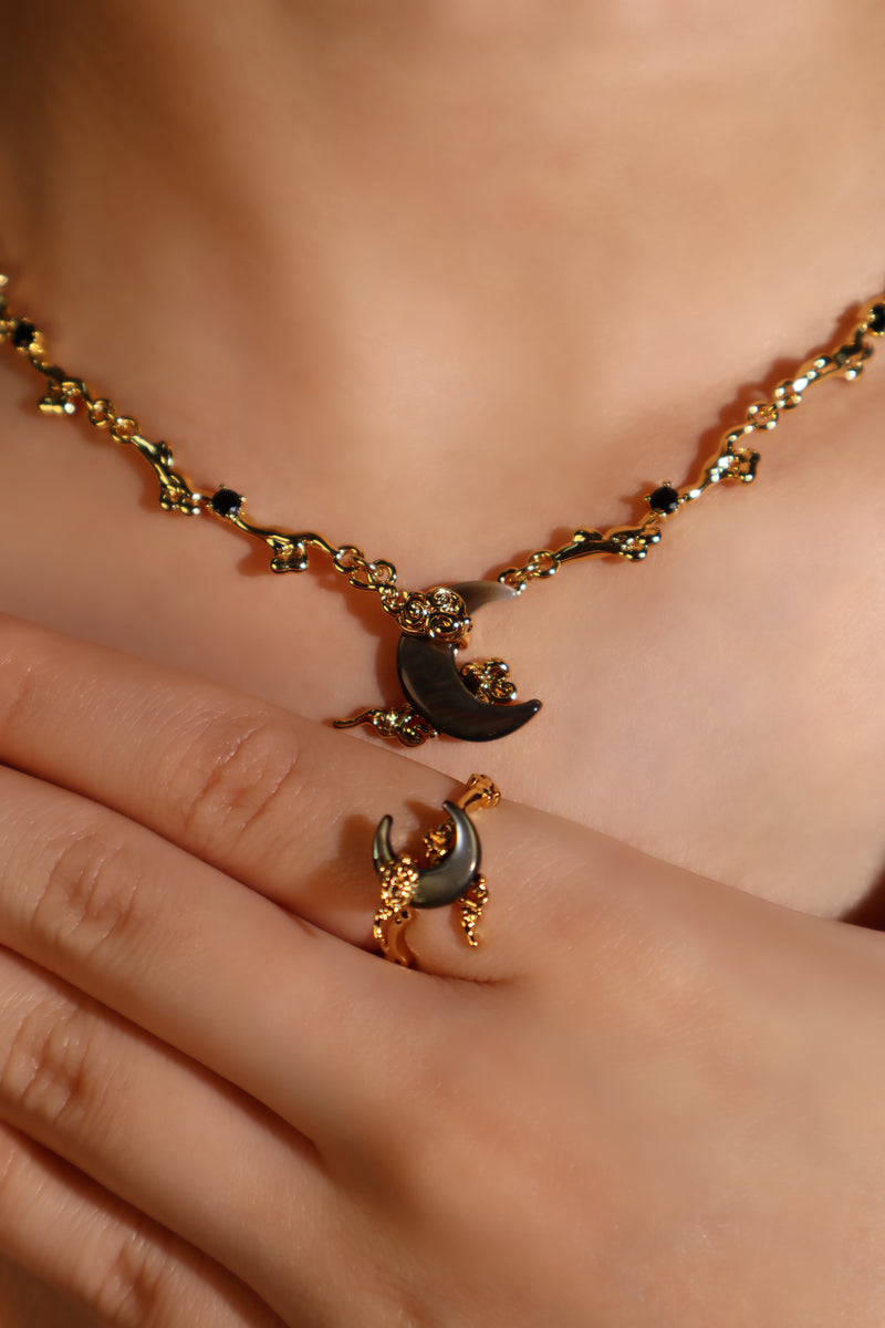 18K gold plated ring with a black natural shell moon on an adjustable band
