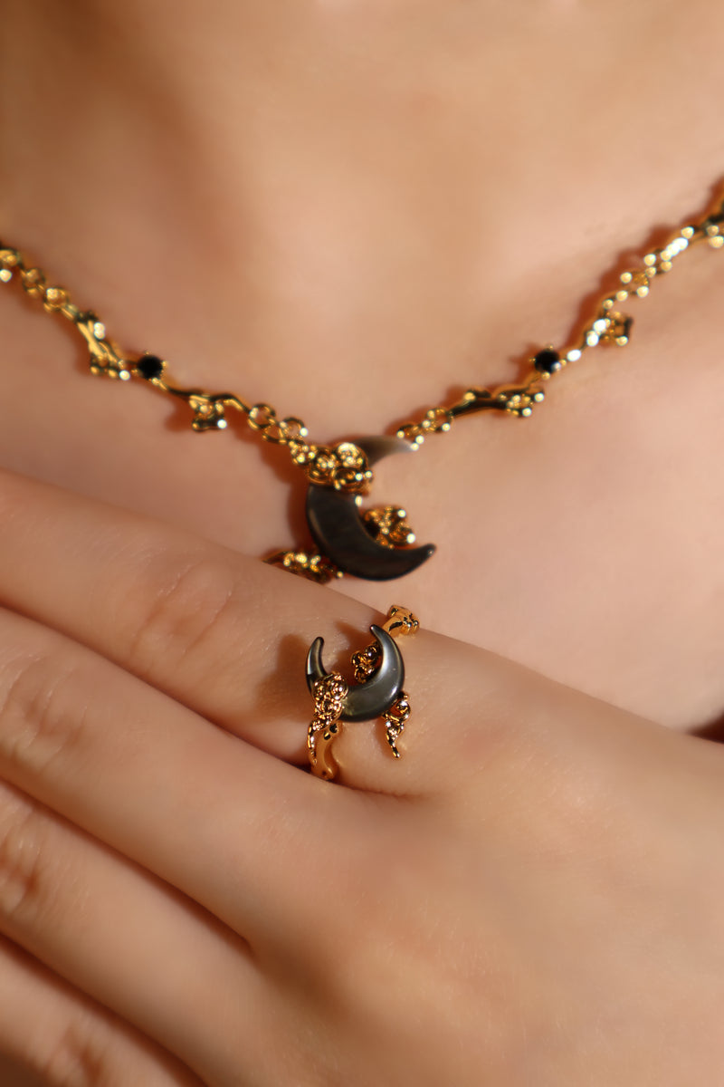 18K gold plated ring with a black natural shell moon on an adjustable band