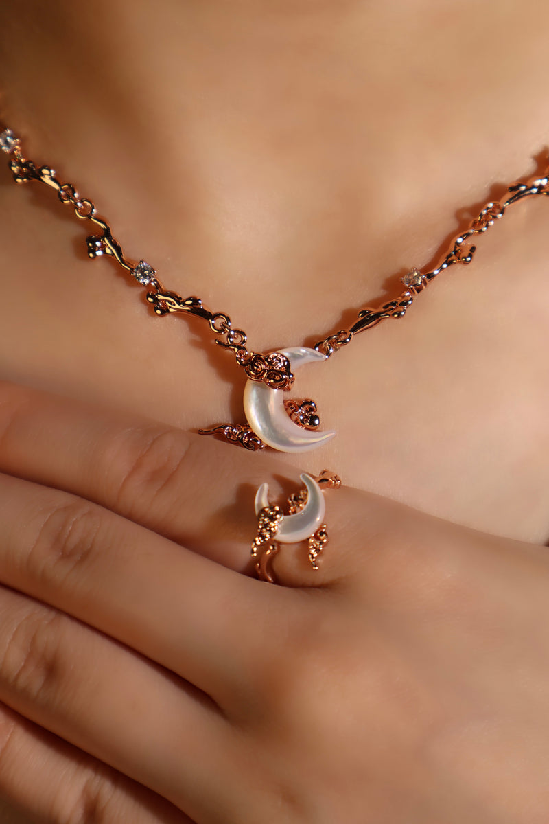 18K rose gold plated ring with a white natural shell moon on an adjustable band