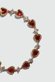 18K gold plated bracelet with a row of sparkling red zirconia hearts and clear zirconia