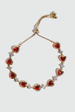 18K gold plated bracelet with a row of sparkling red zirconia hearts and clear zirconia