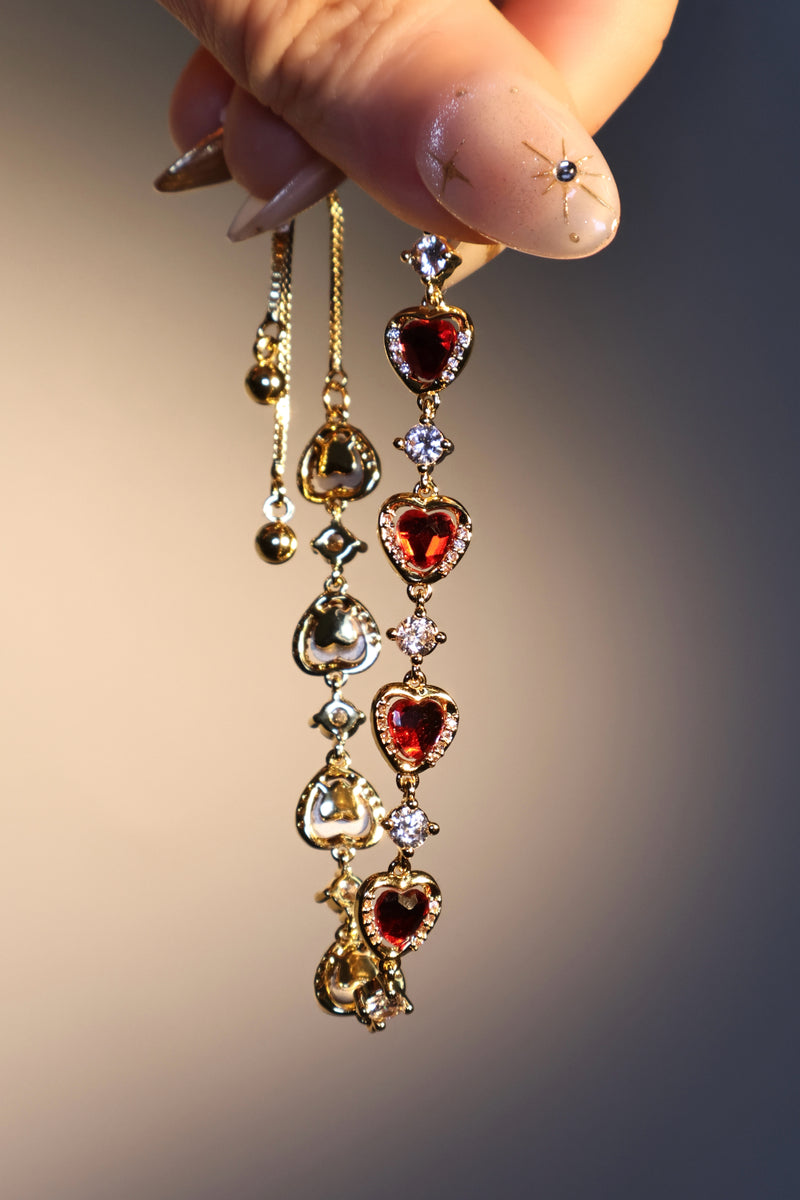 18K gold plated bracelet with a row of sparkling red zirconia hearts and clear zirconia