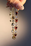 18K gold plated bracelet with a row of sparkling red zirconia hearts and clear zirconia