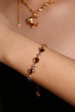 18K gold plated bracelet with a row of sparkling red zirconia hearts and clear zirconia