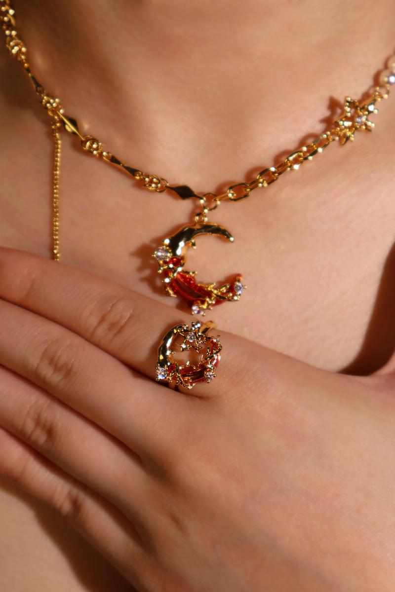 18K gold plated ring with a deep red crescent moon and sparkling zirconia on an adjustable band