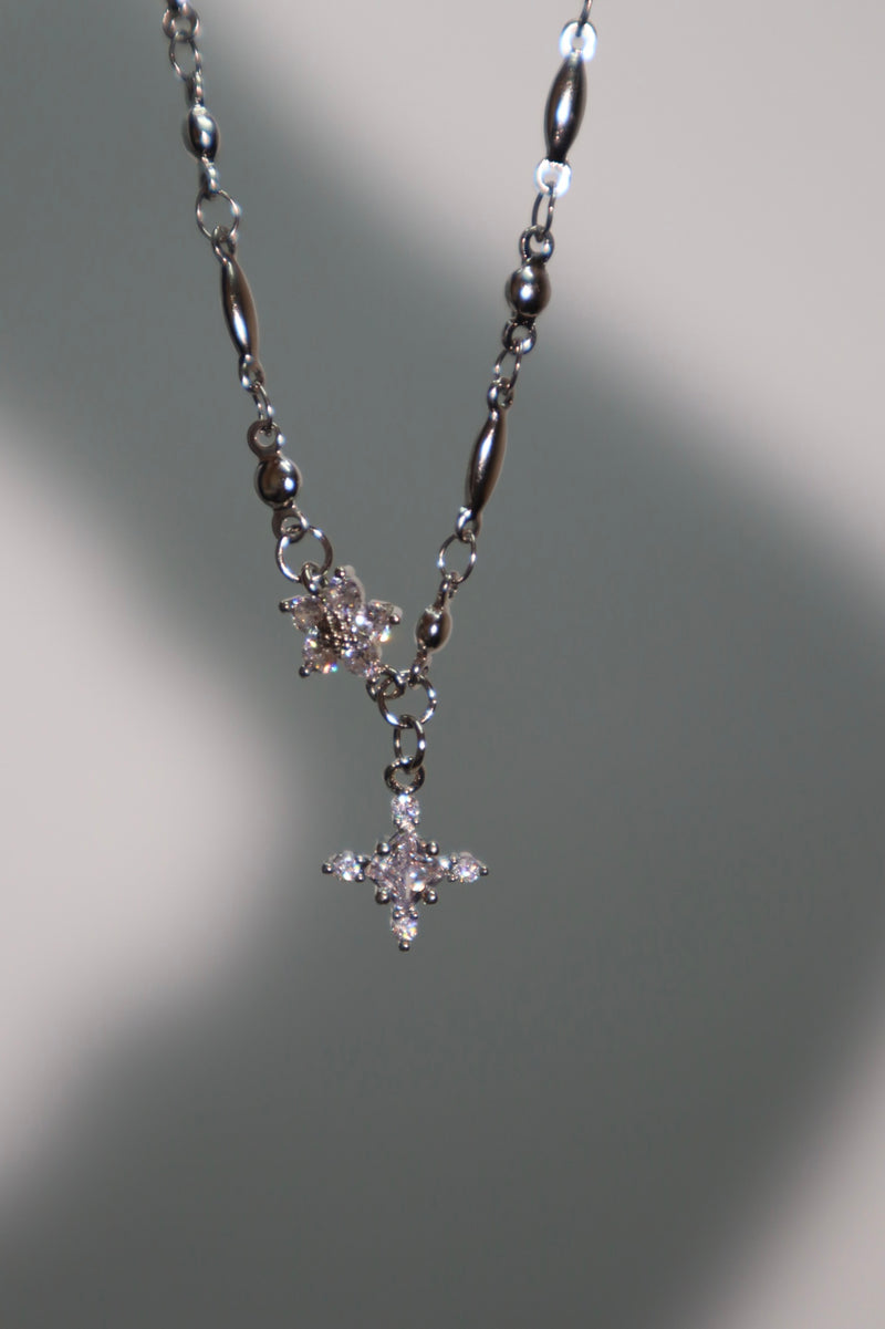 Palladium white gold plated cross necklace on a stainless steel chain with zirconia diamonds