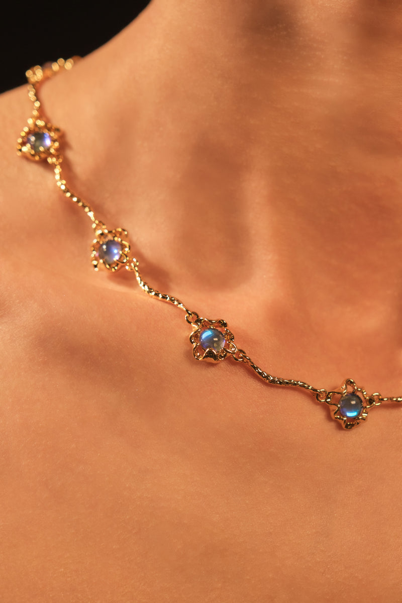 18K gold-plated necklace with multiple deep blue zirconia moonstones on a delicate chain