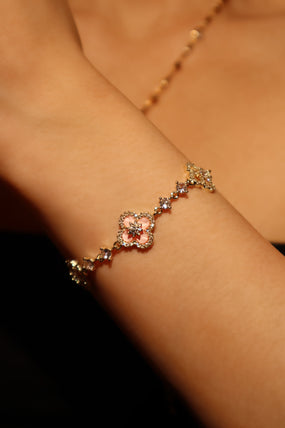 14K gold-plated lucky leaf bracelet with zirconia diamonds and pink resin accents