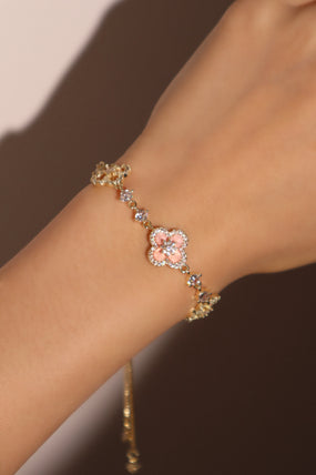 14K gold-plated lucky leaf bracelet with zirconia diamonds and pink resin accents