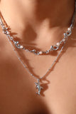 Platinum Plated Dolphin In Waves Necklace