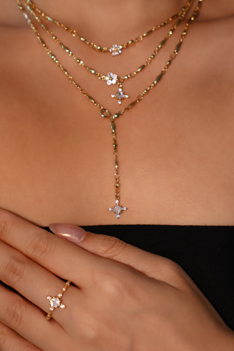 Gold-plated adjustable starlight ring set with sparkling cubic zirconia stones across the band