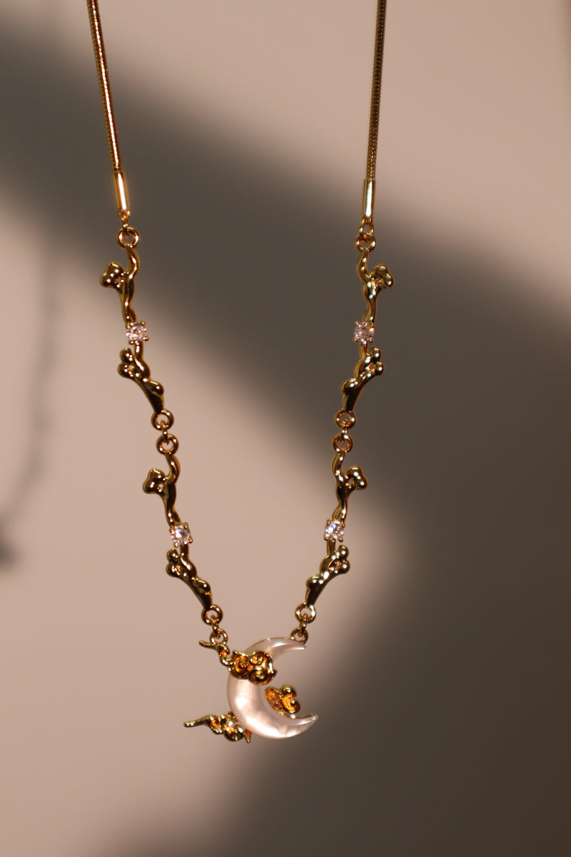 18K gold-plated crescent moon necklace with natural white shell pendant and zirconia diamonds