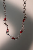 Platinum plated Multi Red Gems Wave Necklace
