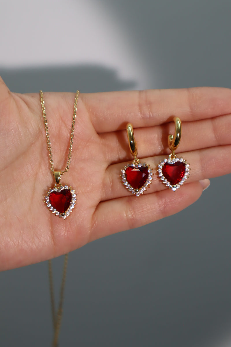 Gold-plated heart earrings with a red zirconia gemstone and sparkling zirconia diamonds