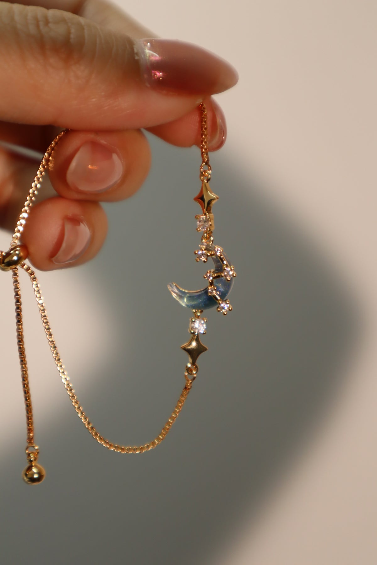 18K gold plated bracelet with a glowing moonstone, crescent moon and star charm, adjustable