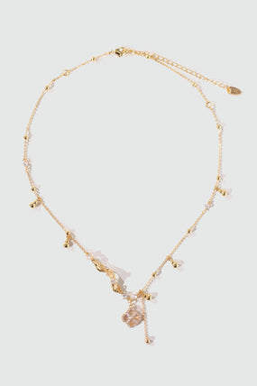 Gold-plated spiral necklace with lucky leaf motif, natural shell pearls and zirconia diamonds