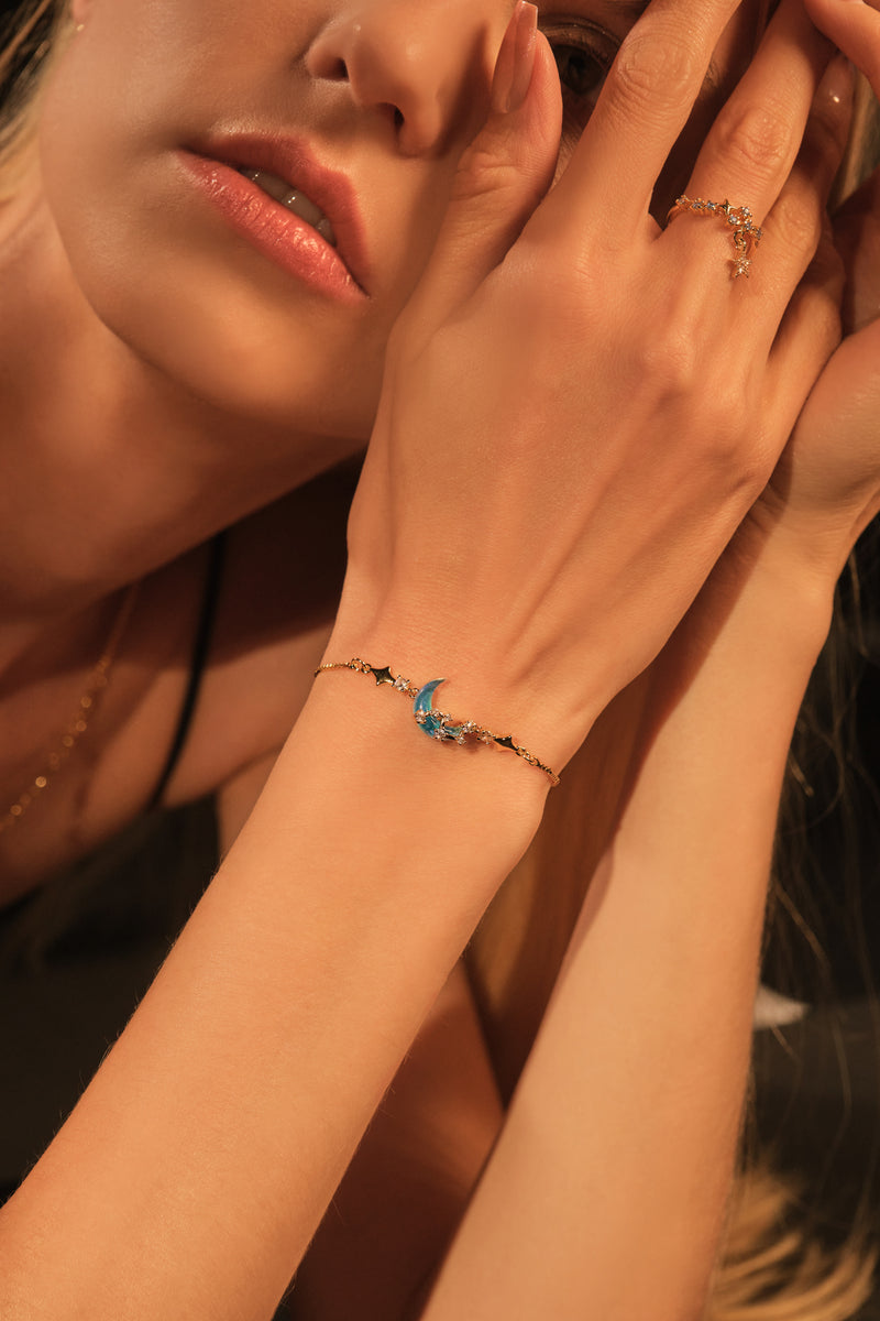 Gold-plated adjustable meteor ring with blue zirconia gemstones and diamonds