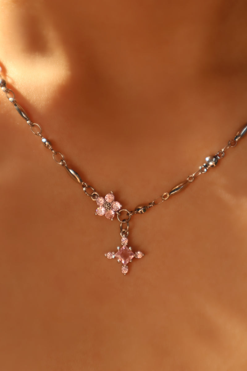 Palladium white-gold-plated cross necklace set with pink zirconia gemstones