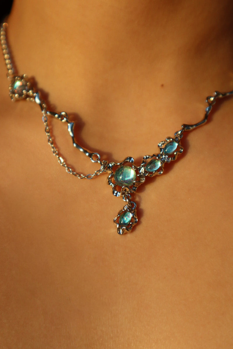 Palladium white-gold-plated dangle necklace with zirconia opal pendants on a stainless steel chain