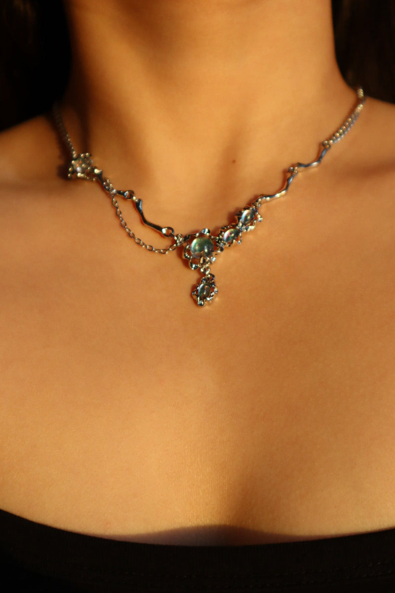 Palladium white-gold-plated dangle necklace with zirconia opal pendants on a stainless steel chain