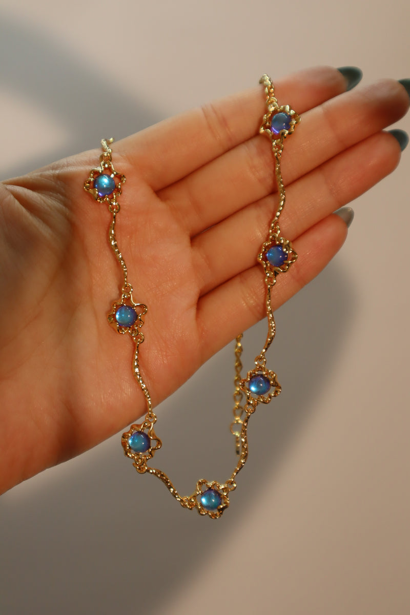 18K gold-plated necklace with multiple deep blue zirconia moonstones on a delicate chain