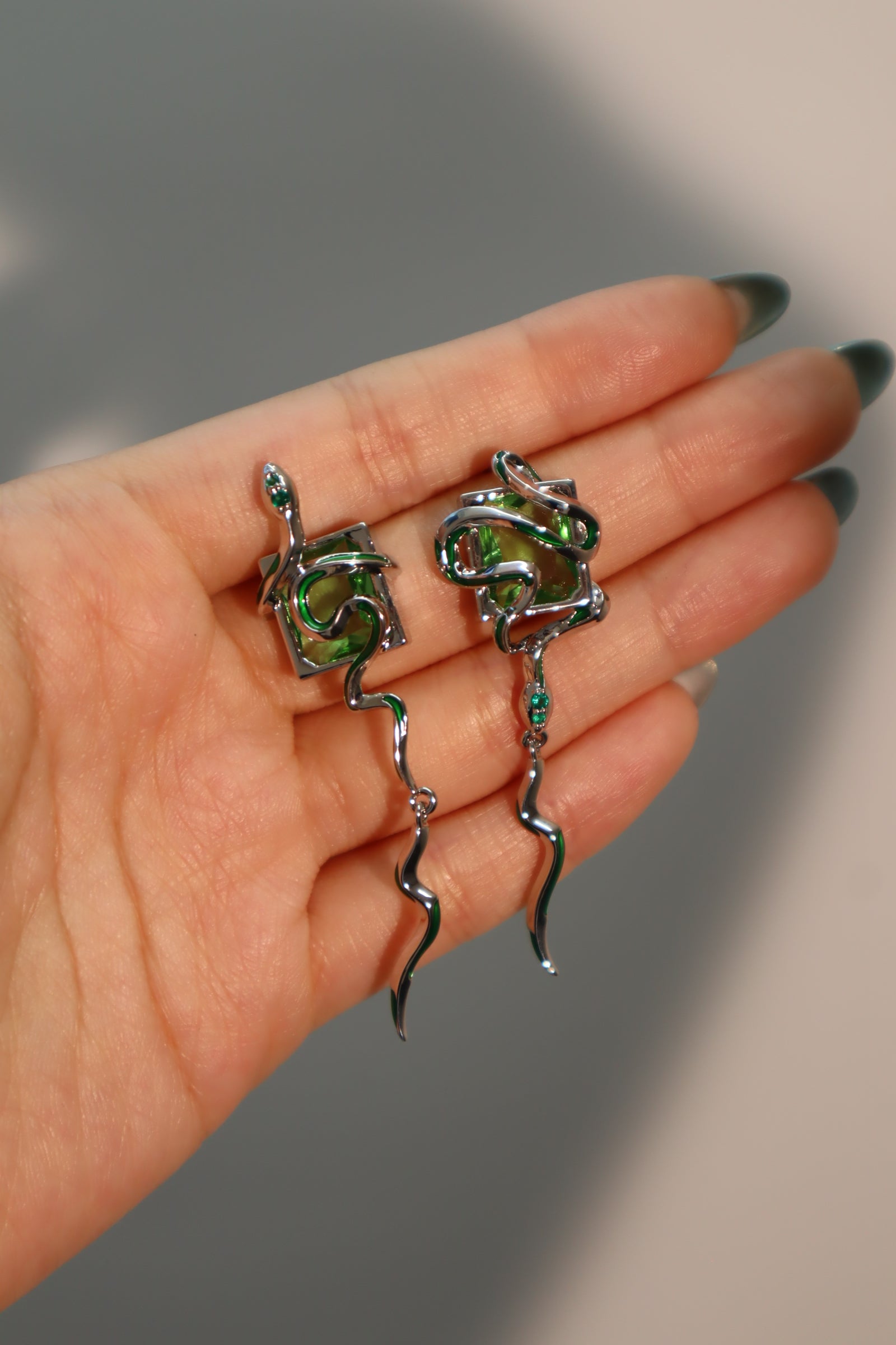Platinum plated green gems snake Earrings