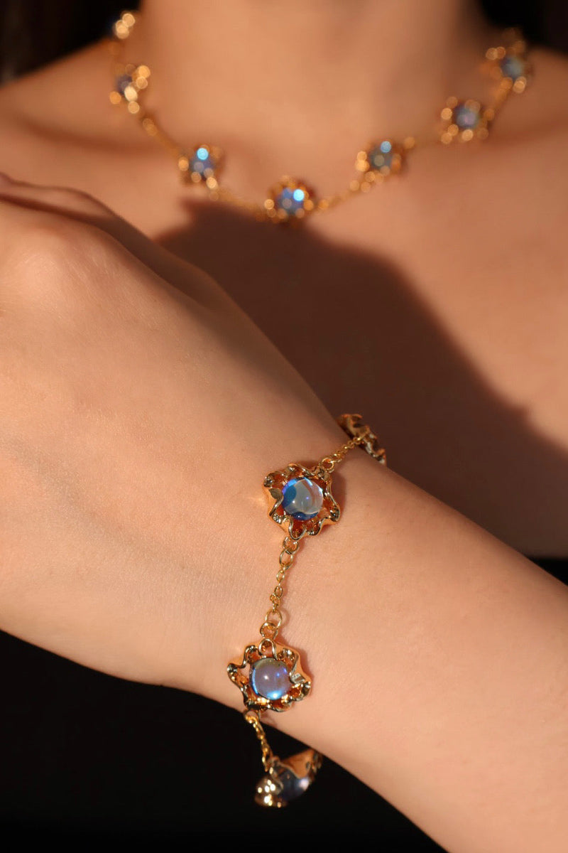 18K gold-plated necklace with multiple deep blue zirconia moonstones on a delicate chain