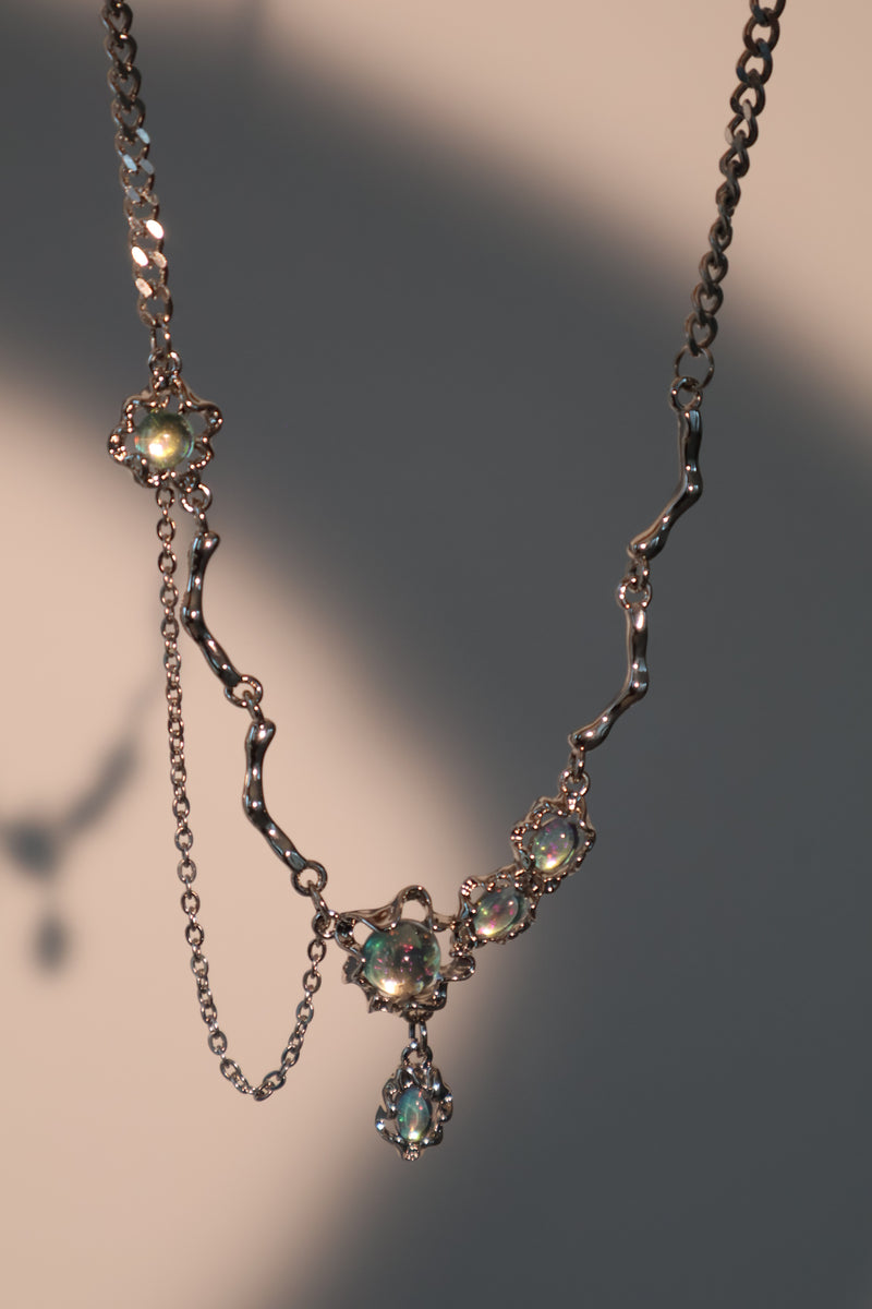 Palladium white-gold-plated dangle necklace with zirconia opal pendants on a stainless steel chain