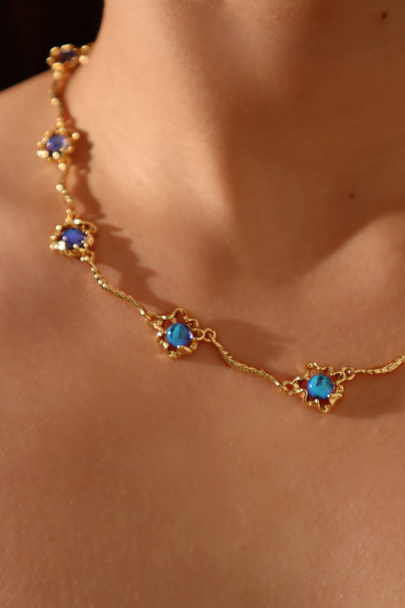 18K gold-plated necklace with multiple deep blue zirconia moonstones on a delicate chain