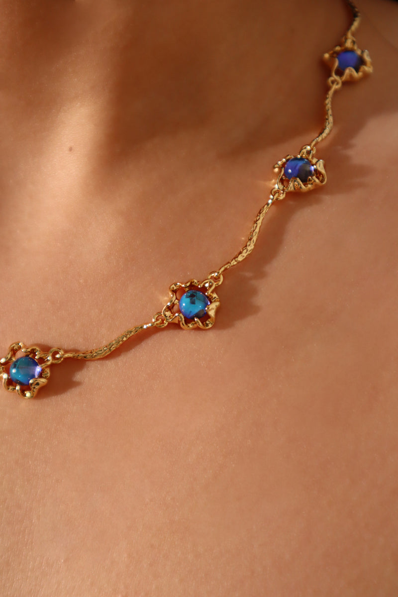 18K gold-plated necklace with multiple deep blue zirconia moonstones on a delicate chain