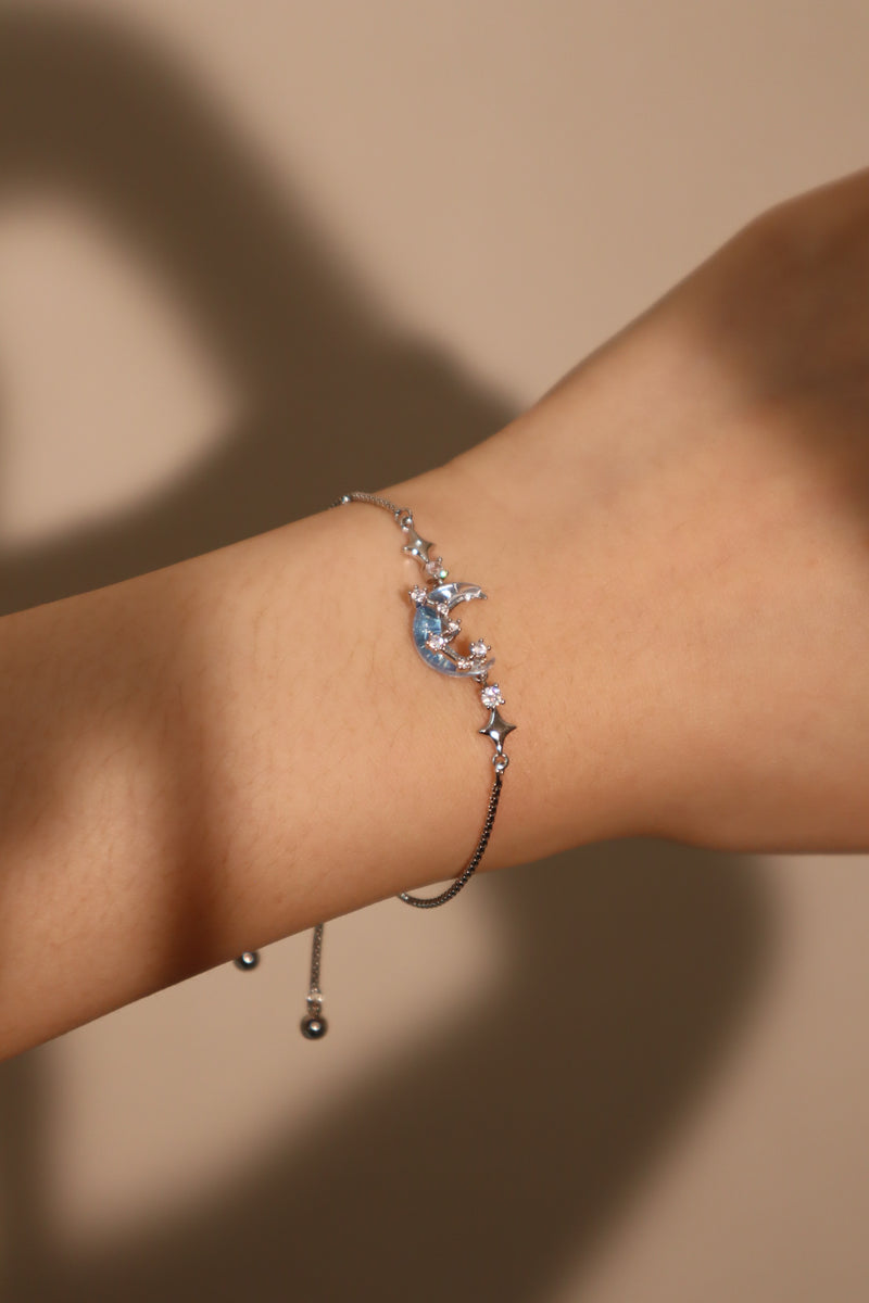 Palladium white gold plated chain bracelet with moonstone, crescent moon and star charms