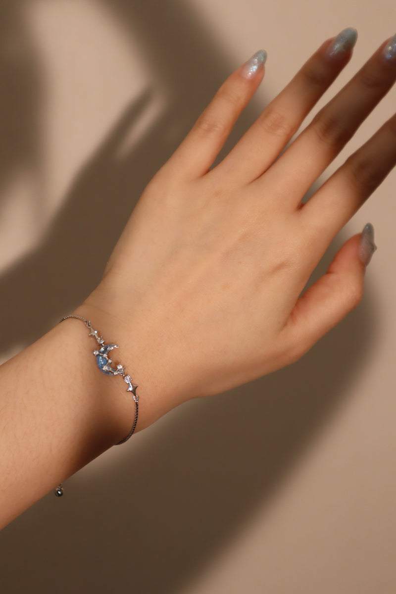 Palladium white gold plated chain bracelet with moonstone, crescent moon and star charms