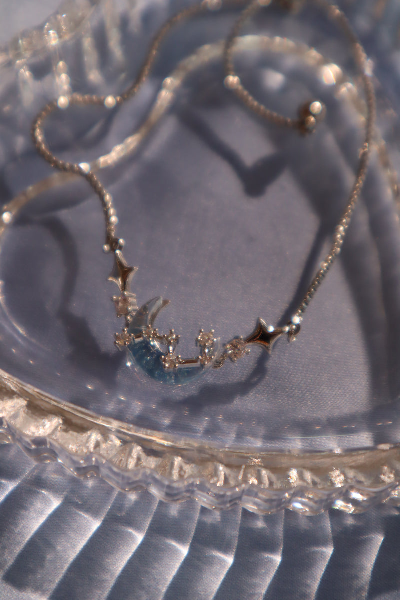 Palladium white gold plated chain bracelet with moonstone, crescent moon and star charms