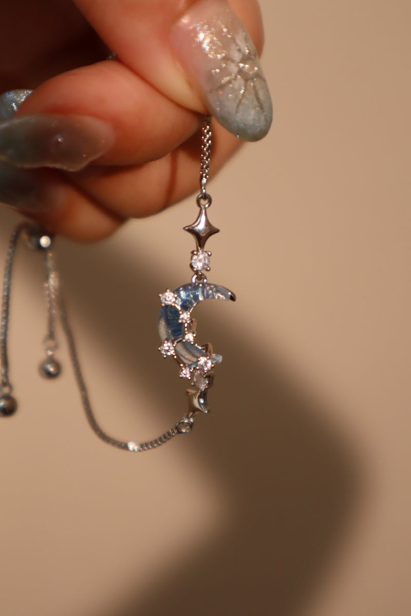 Palladium white gold plated chain bracelet with moonstone, crescent moon and star charms