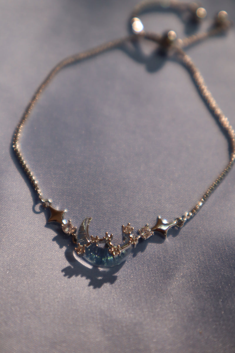 Palladium white gold plated chain bracelet with moonstone, crescent moon and star charms