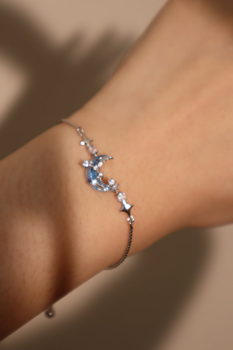 Palladium white gold plated chain bracelet with moonstone, crescent moon and star charms