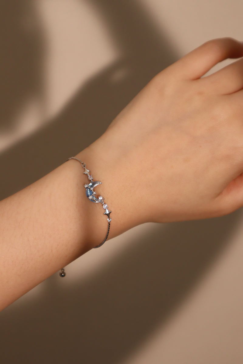 Palladium white gold plated chain bracelet with moonstone, crescent moon and star charms