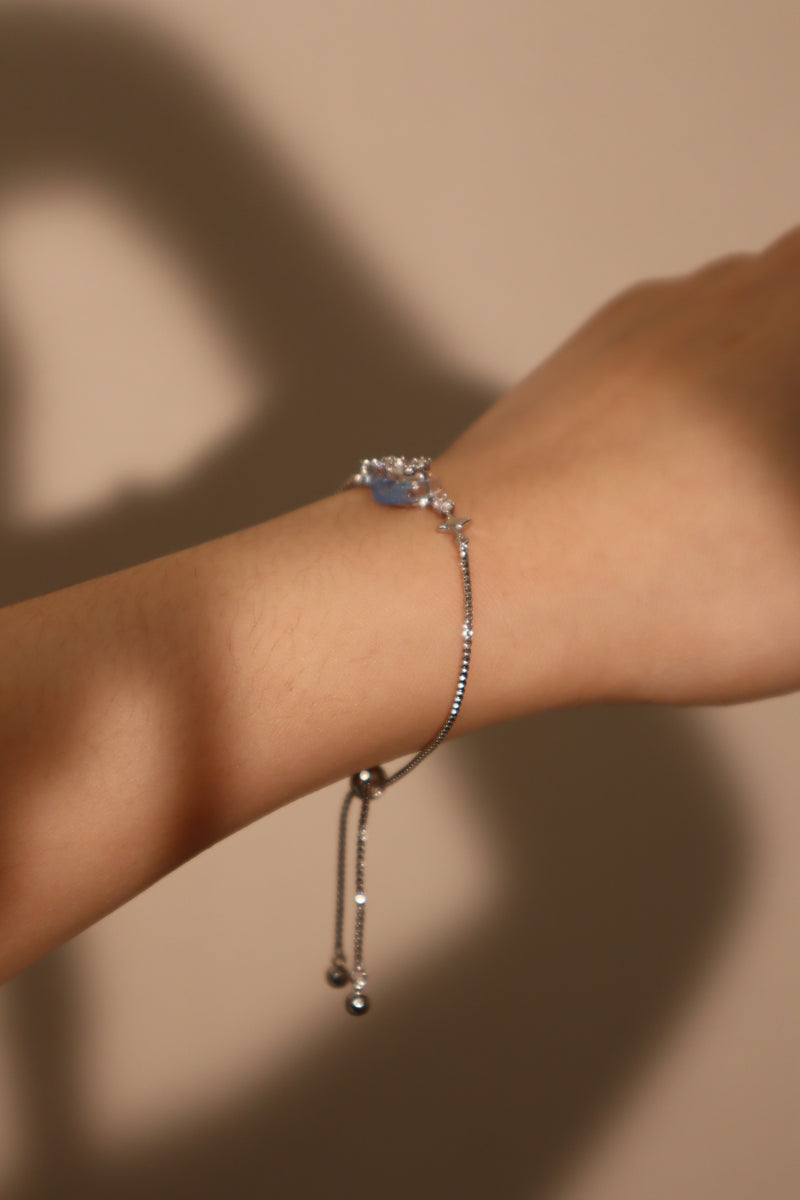 Palladium white gold plated chain bracelet with moonstone, crescent moon and star charms
