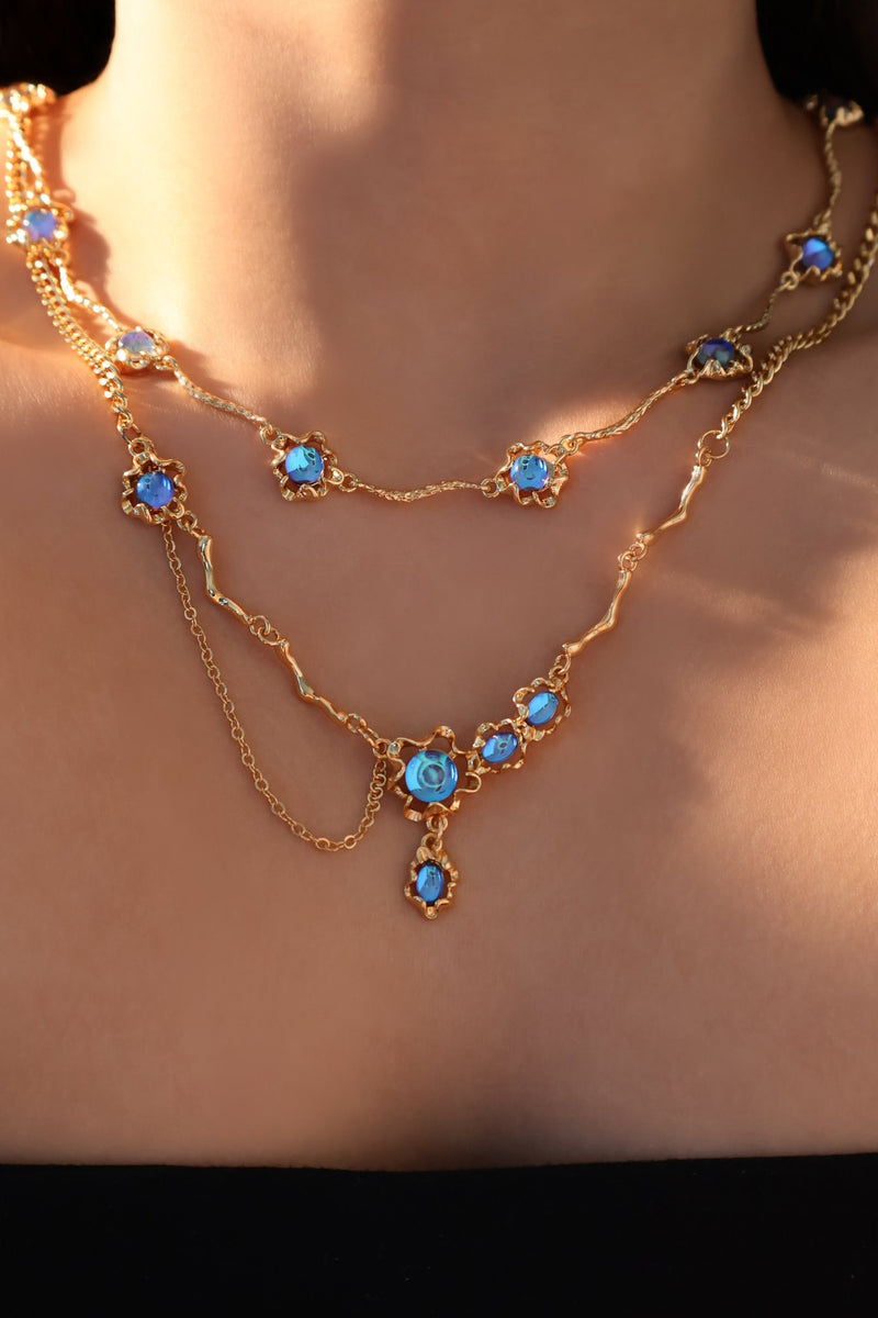 18K gold-plated necklace with multiple deep blue zirconia moonstones on a delicate chain