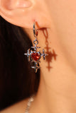 Platinum plated red gems cross earrings