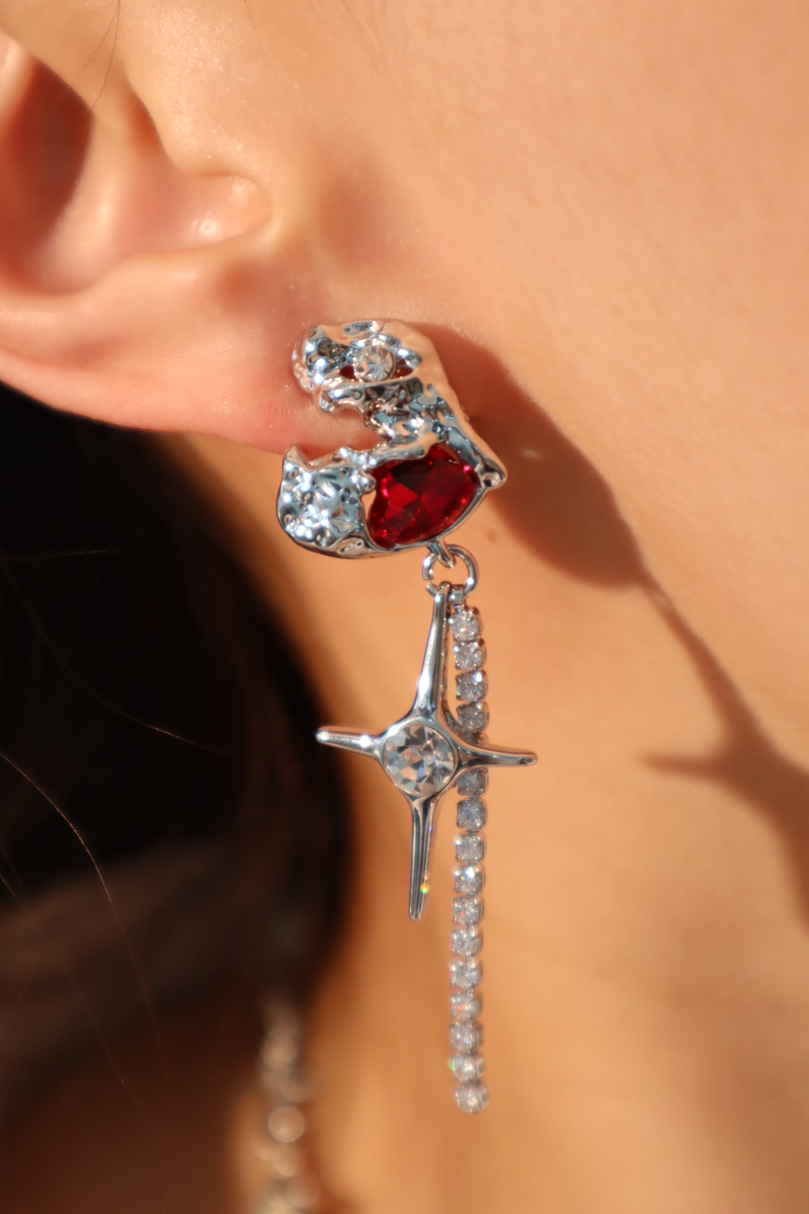 Platinum plated red gem star earrings
