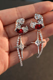 Platinum plated red gem star earrings