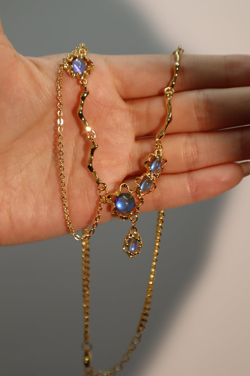 18K gold-plated dangle necklace with deep blue zirconia moonstones